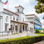 Couple walking past historic Hot Springs bath house